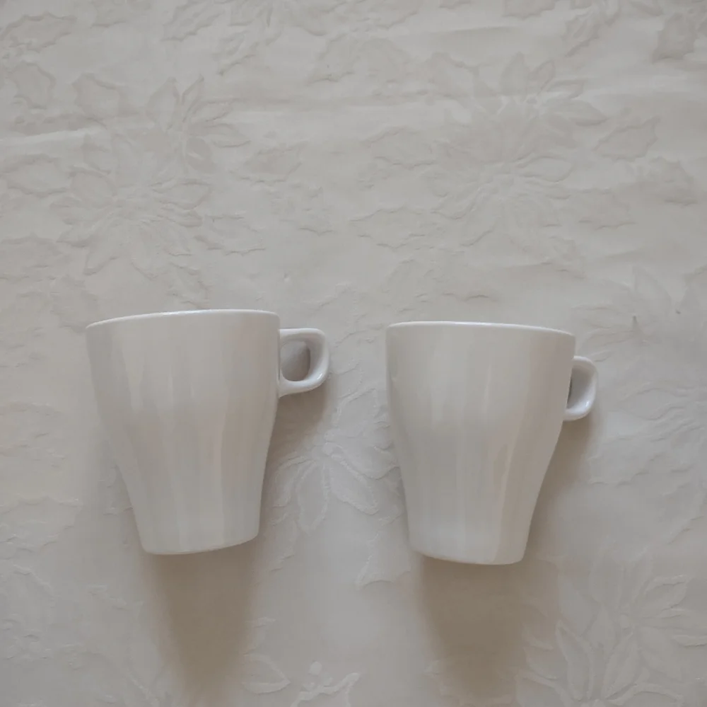 2 white tall cups mugs IKEA Sweden coffee tea